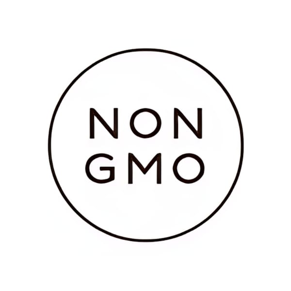 Black and white circular logo with "NON GMO" text inside, indicating Green Table Cafe's commitment.
