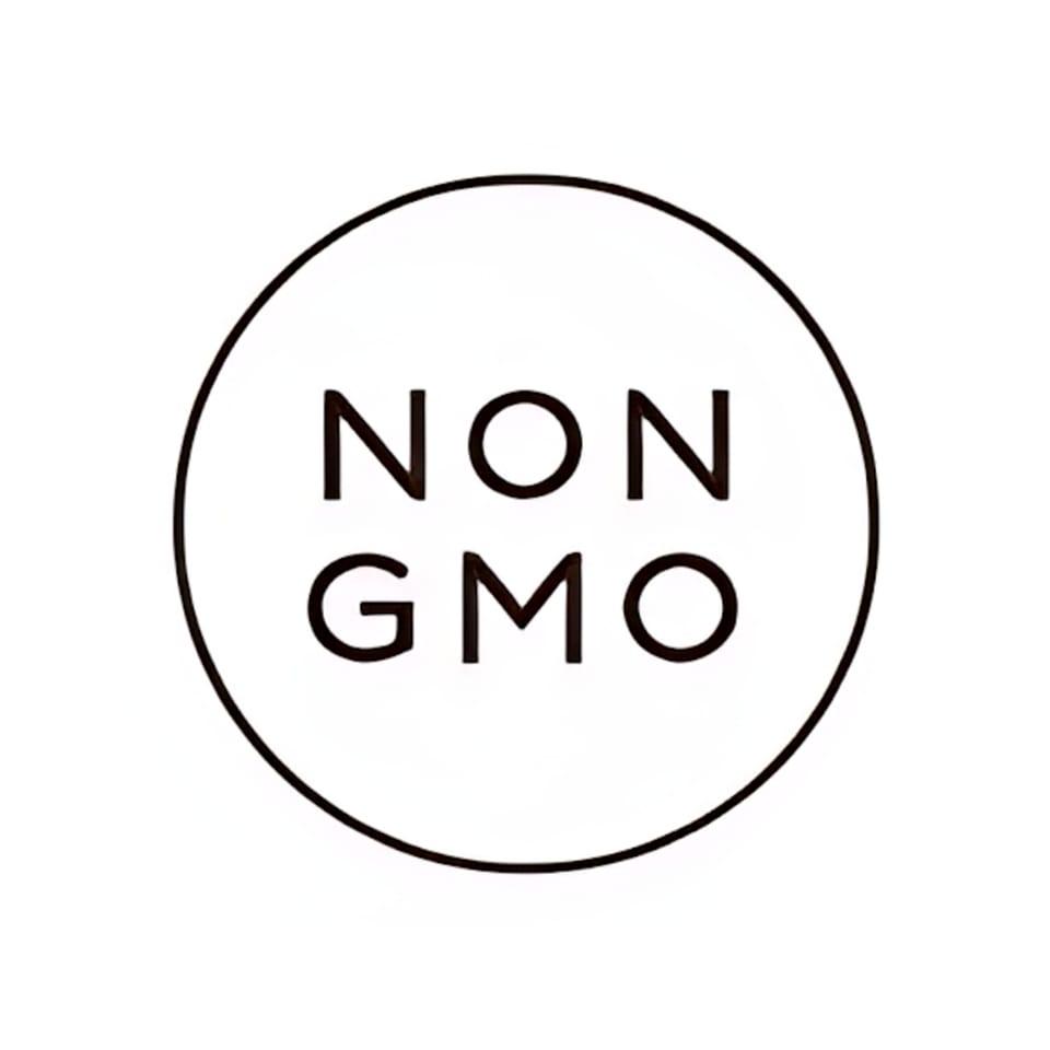Black and white circular logo with "NON GMO" text inside, indicating Green Table Cafe's commitment.