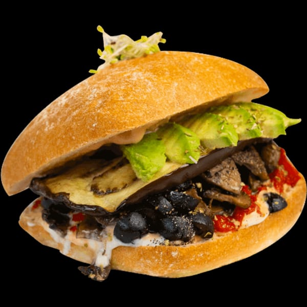 A Green Table Cafe sandwich with grilled eggplant, mushrooms, olives, avocado, and red peppers.